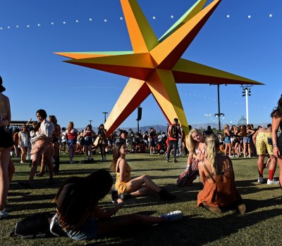 Festival goers pose in front of the SUPERNOVA art installation, by Roberto Behar & Rosario Marquardt (R&R Studios), during day 2 of the Coachella Valley Music and Arts Festival at the Empire Polo Club in Indio, CA., Saturday, April 14, 2018. (Staff photo by Jennifer Cappuccio Maher, The Press-Enterprise/SCNG)